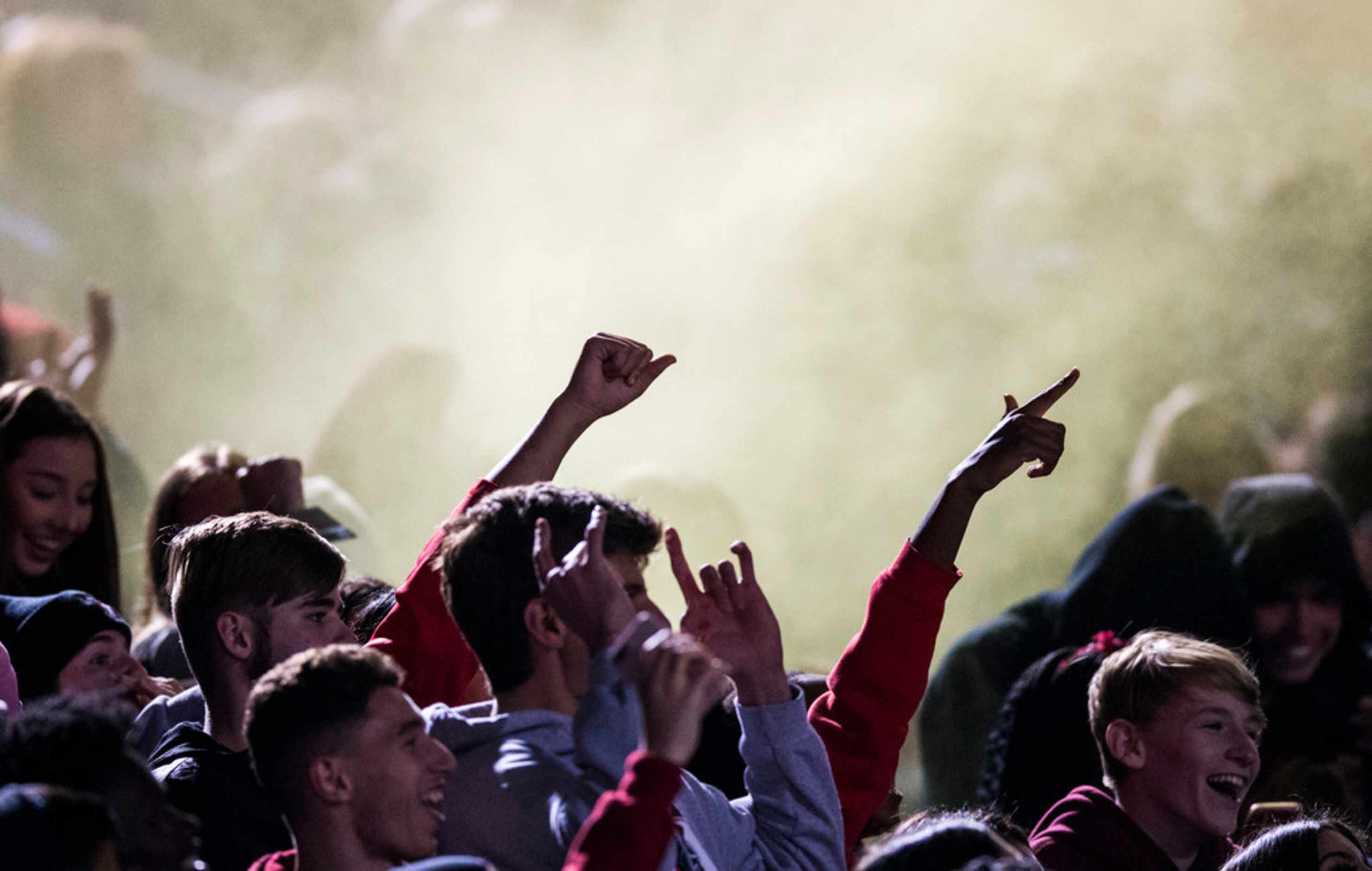 Euless Trinity fans celebrate a touchdown during the second quarter of a UIL Class 6A...