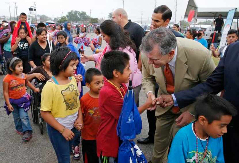 
Dallas Mayor Mike Rawlings greeted families at the start of the Back-to-School Fair. The...