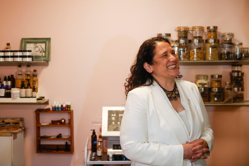 Small Business Administration Administrator Isabella Guzman reacts while listening to Wesley...