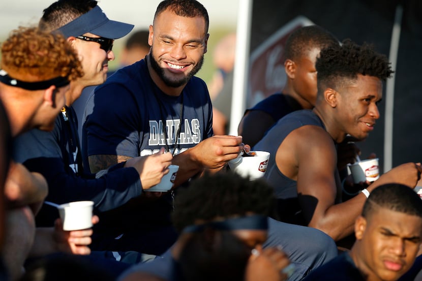 Dallas Cowboys quarterback Dak Prescott (center) joined Lone Star High School football coach...