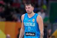 Slovenia's Luka Doncic heads off the court after receiving his second technical foul during...