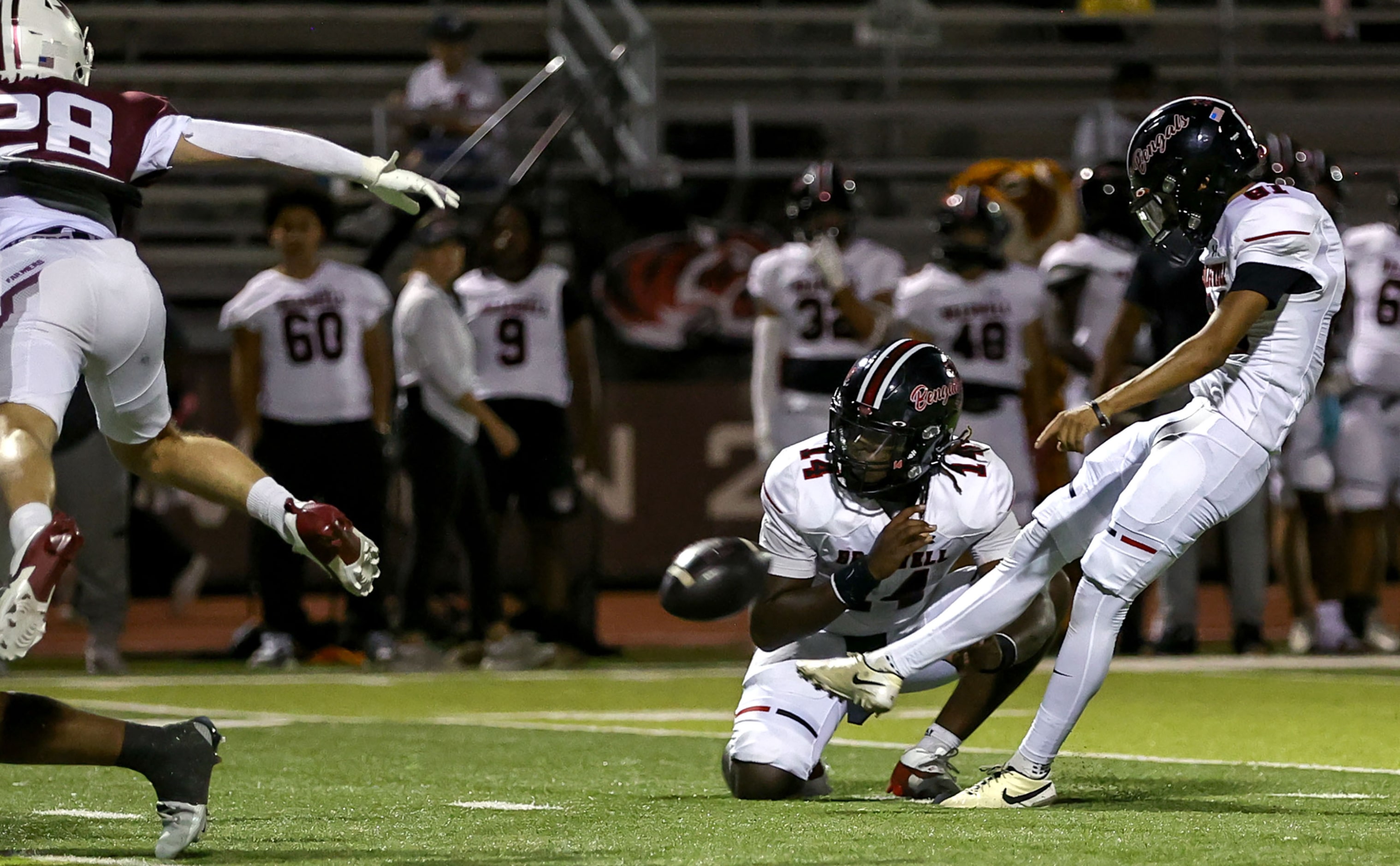 Denton Braswell kicker Sebastian Flores attempts a field goal against Lewisville during the...