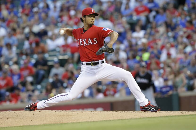 Texas Rangers starting pitcher Yu Darvish, of Japan, throws during the fourth inning of a...