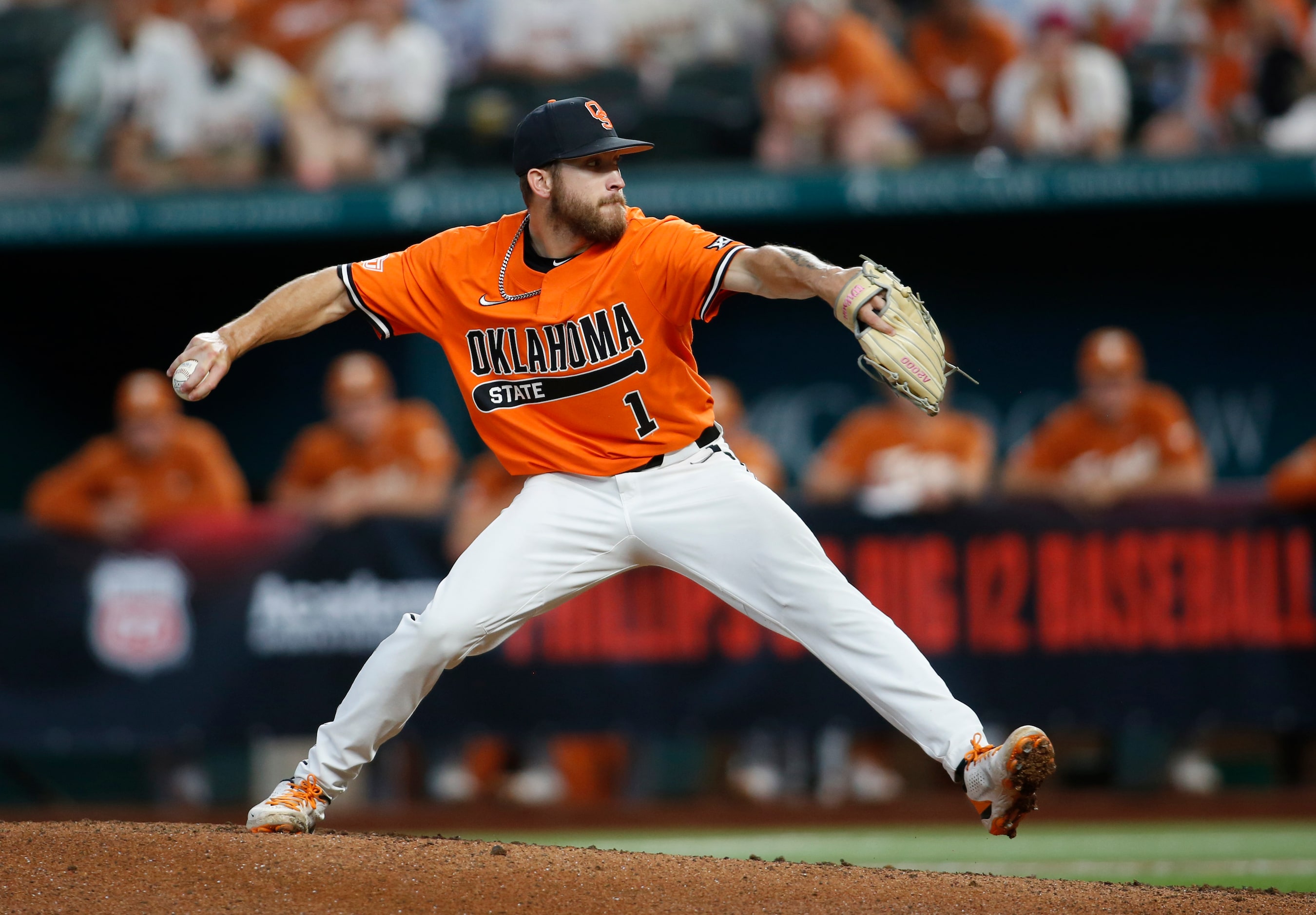 Oklahoma State pitcher Hueston Murrill (1) delivers a pitch to a Texas Longhorns batter...