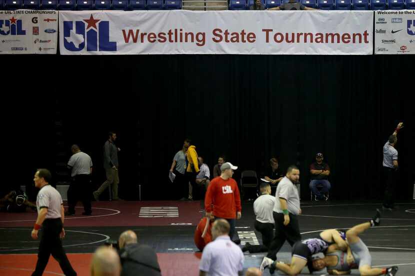 Wrestlers compete during the boys quarterfinal round of the UIL Wrestling State Championship...