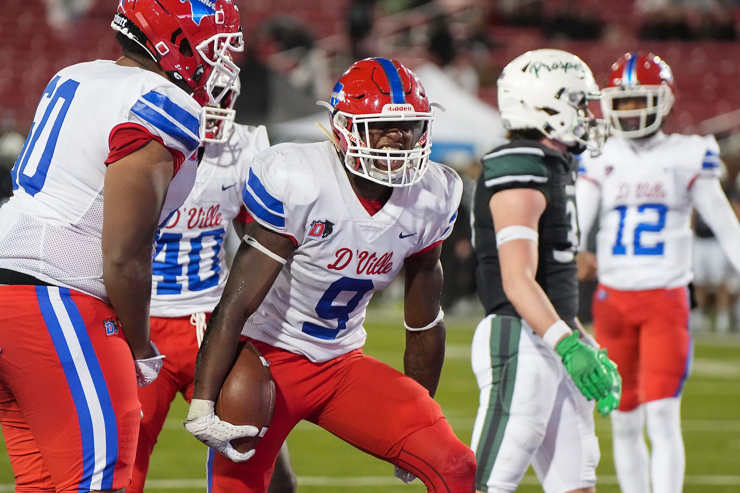 Duncanville running back Kaleb Kenney (9) celebrates after scoring on a one-yard run during...