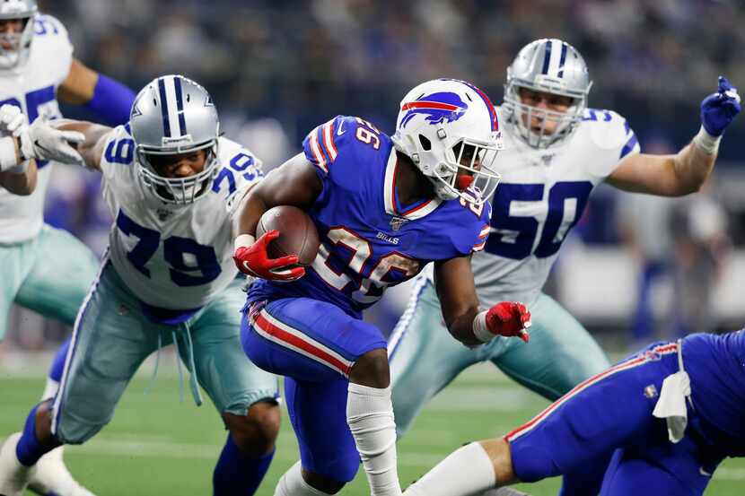 Buffalo Bills running back Devin Singletary (26) runs up the field as Dallas Cowboys...
