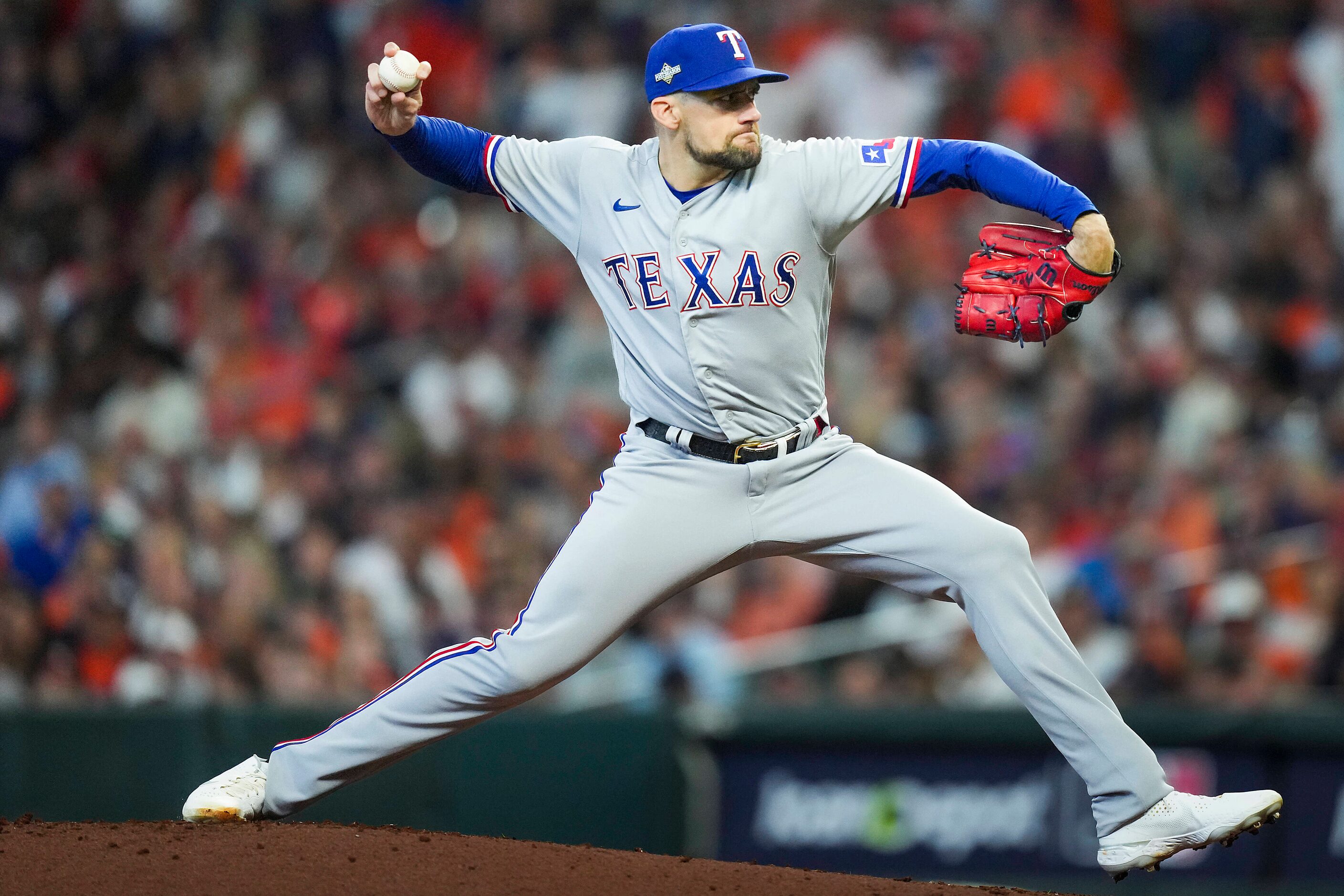 Texas Rangers starting pitcher Nathan Eovaldi delivers during the first inning in Game 2 of...