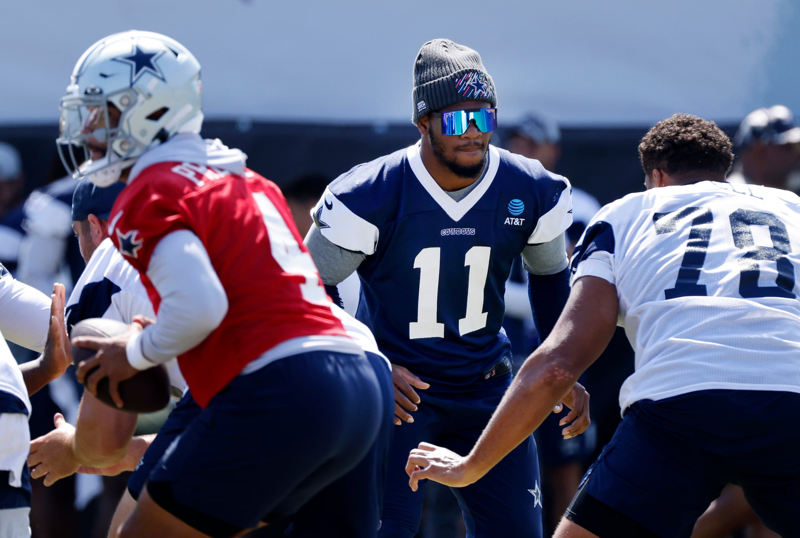 Dallas Cowboys quarterback Dak Prescott, center, has a conversation with  teammates defensive end DeMarcus Lawrence, left, linebacker Micah Parsons  during the NFL football team's training camp Saturday, July 29, 2023, in  Oxnard