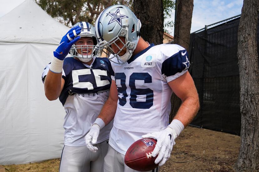 Dallas Cowboys linebacker Leighton Vander Esch (55) congratulates tight end Dalton Schultz...