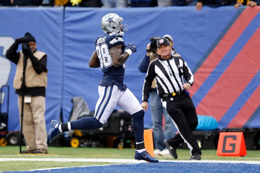 Dallas Cowboys wide receiver Dez Bryant (88) runs in for a touchdown in a game against the...