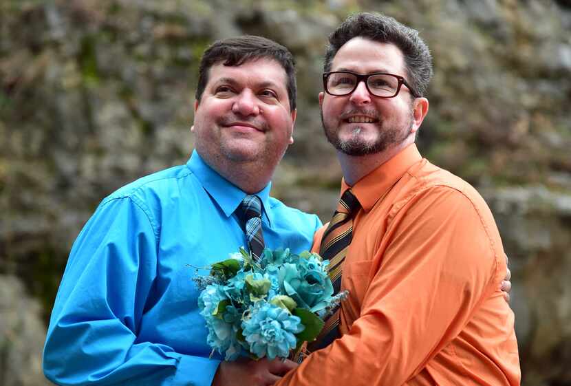 Newlyweds Darren Garrison and Alton Way pose for a photo after getting married in Big Spring...