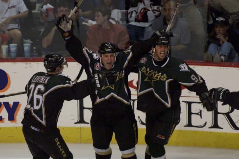 Stanley Cup Finals, Game 6 - The Stars' Jere Lehtinen and Mike Modano celebrate with Brett...