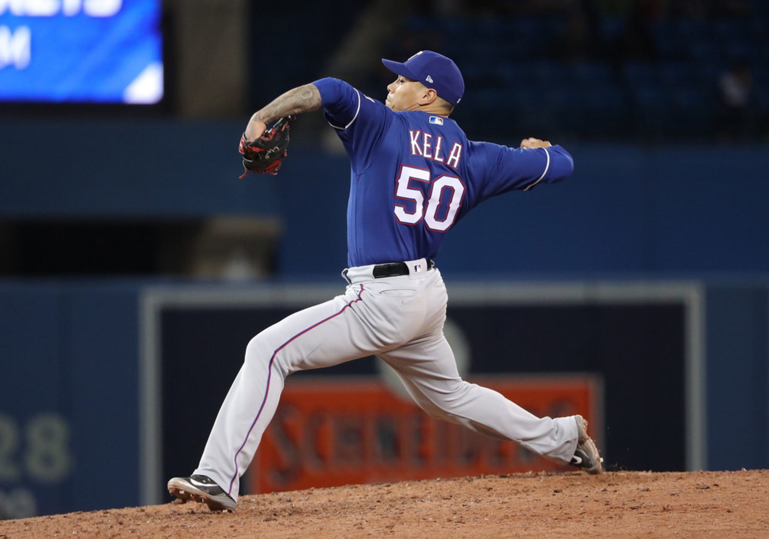 TORONTO, ON - APRIL 27: Keone Kela #50 of the Texas Rangers delivers a pitch in the ninth...