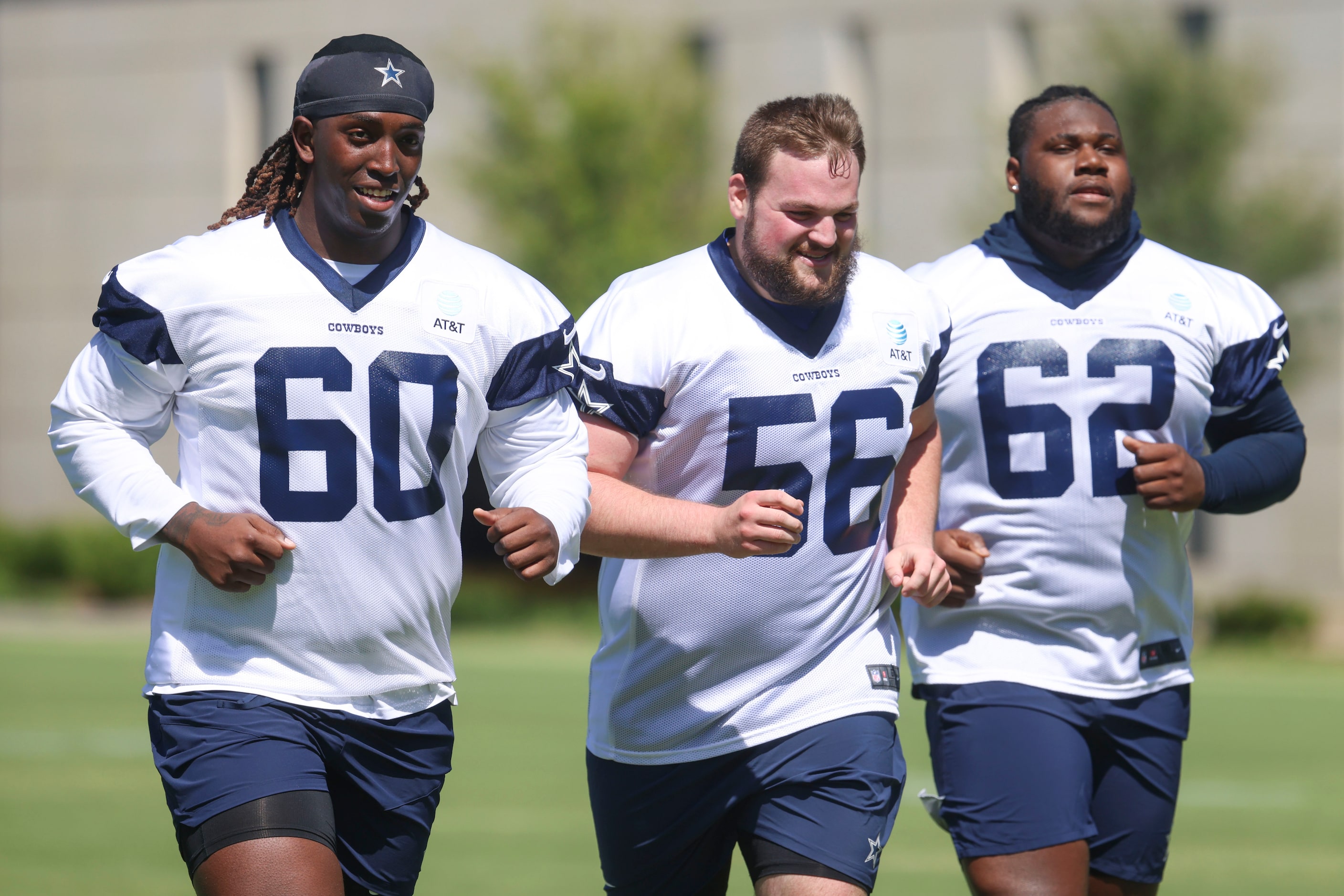 Dallas Cowboys offensive line Tyler Guyton (60) and Cooper Beebe (56), and Nathan Thomas...