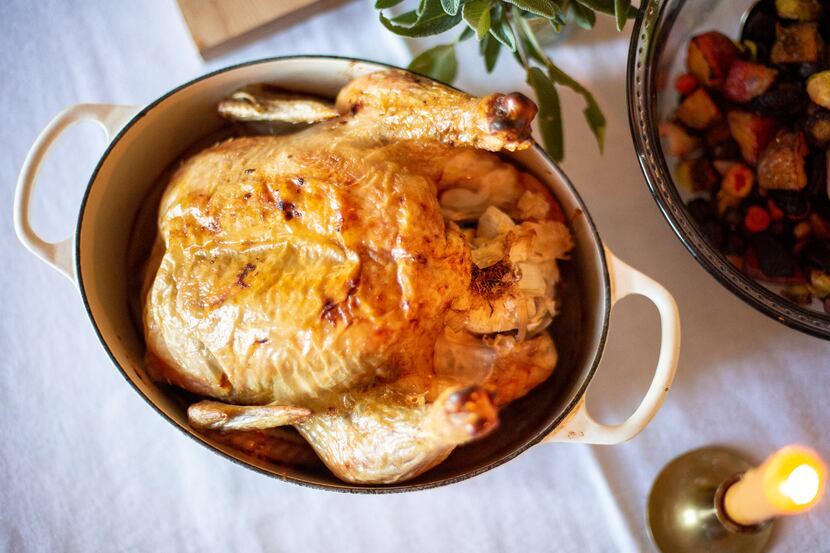 Oven-roasted chicken sits in a Dutch oven on the Chessman’s table on Nov. 9, 2019 at her...