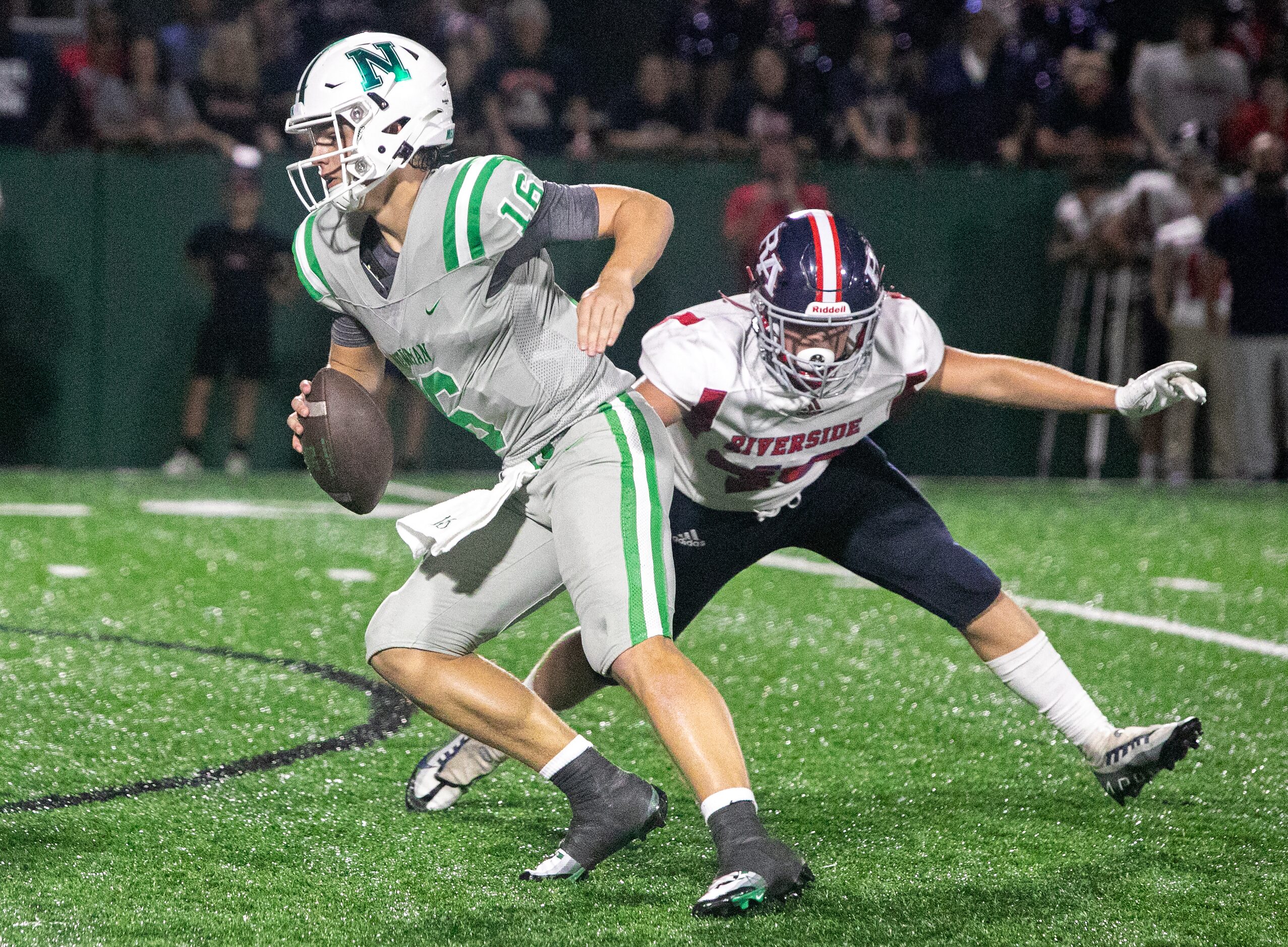 Arch Manning scrambles as his protection breaks down as Newman High School takes on...