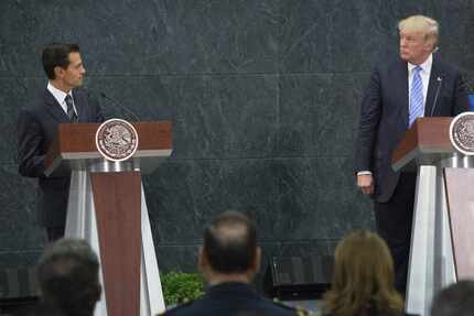 Mexican President Enrique Pena Nieto held a joint news conference in Mexico City with...