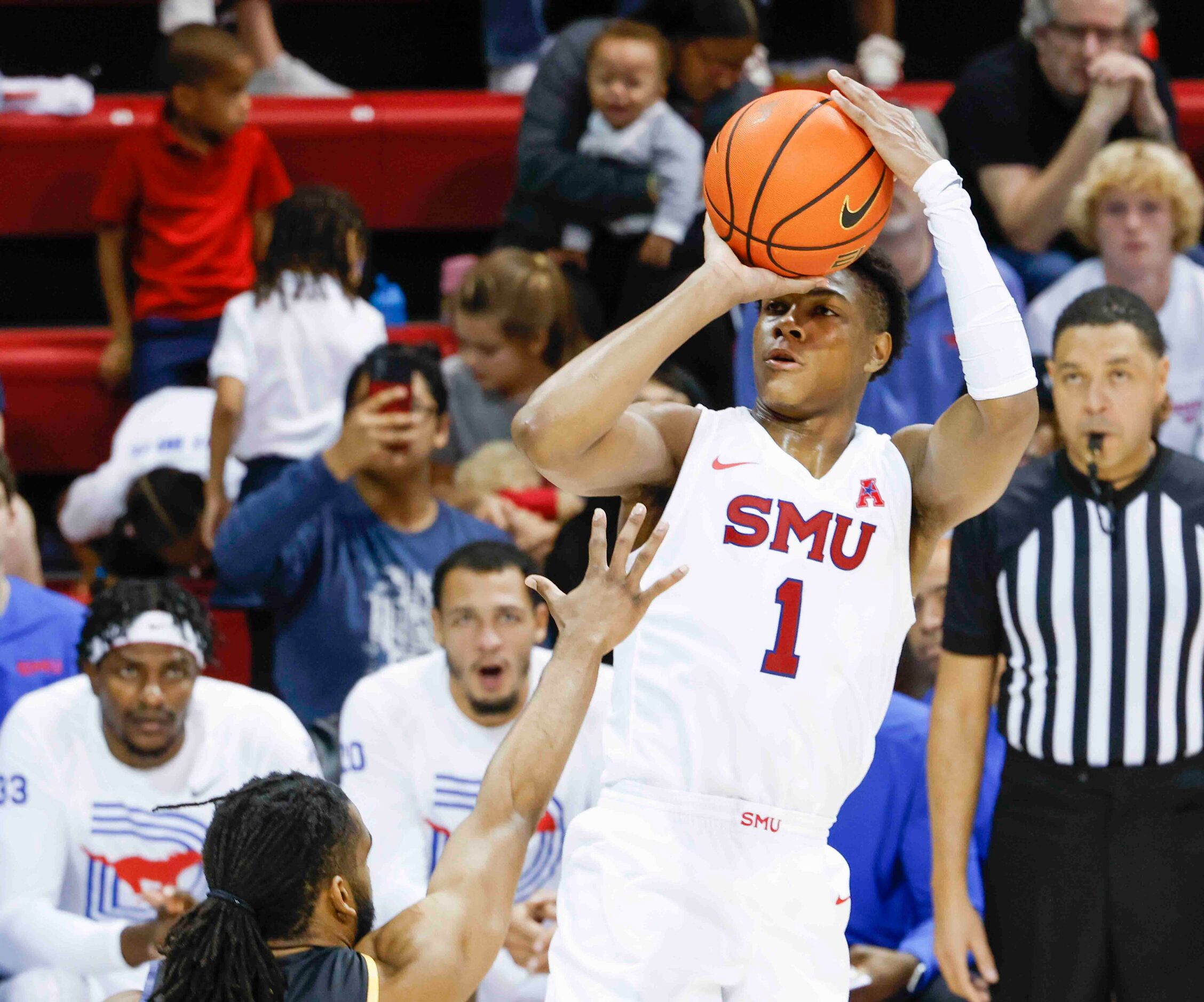 Southern Methodist guard Zhuric Phelps (1) scores a three-pointer against Texas A&M-Comm...