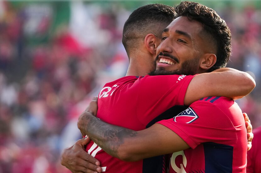 FC Dallas forward Jesús Ferreira (facing) celebrates with midfielder Sebastian Lletget after...