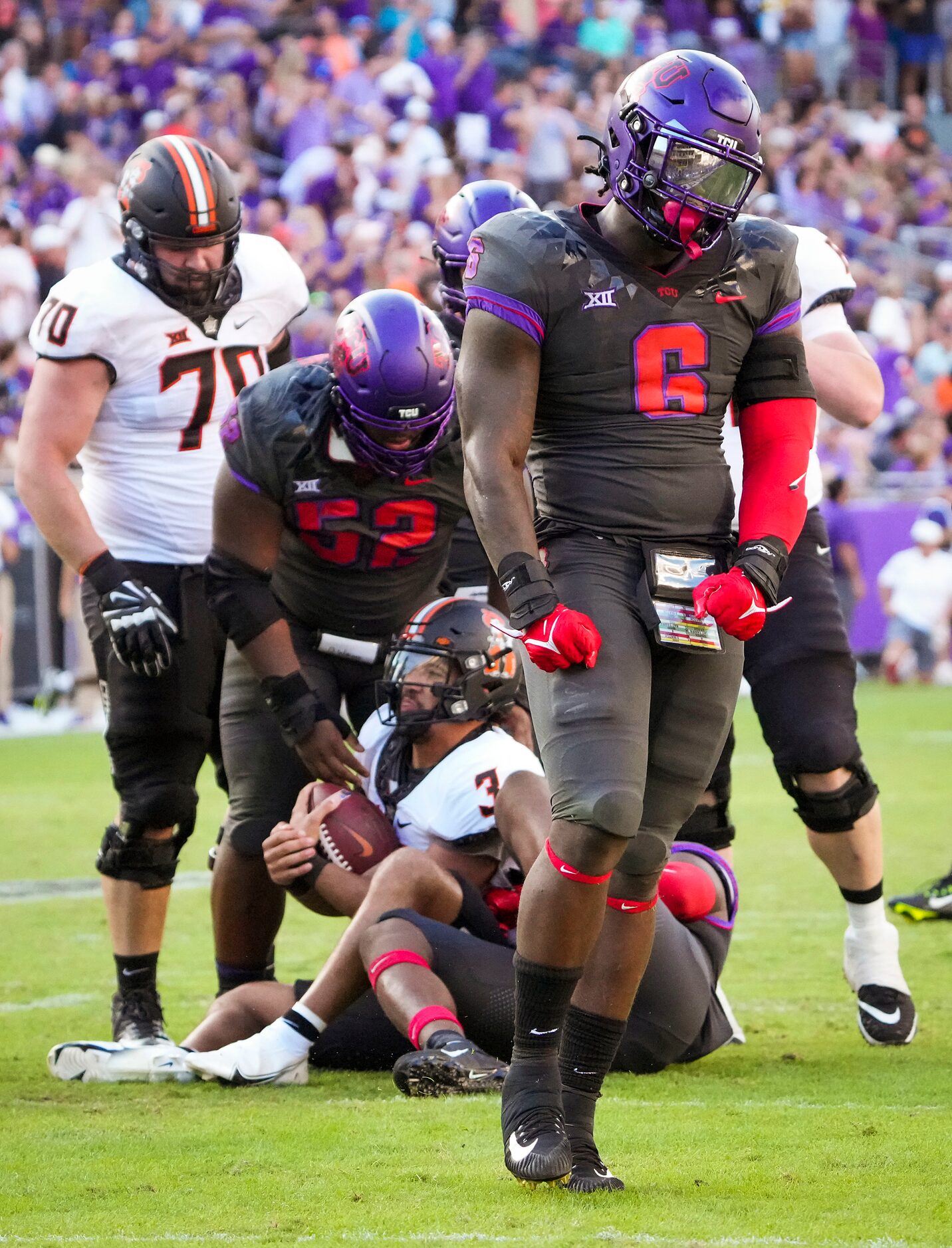 TCU linebacker Jamoi Hodge (6) celebrates after stopping Oklahoma State quarterback Spencer...