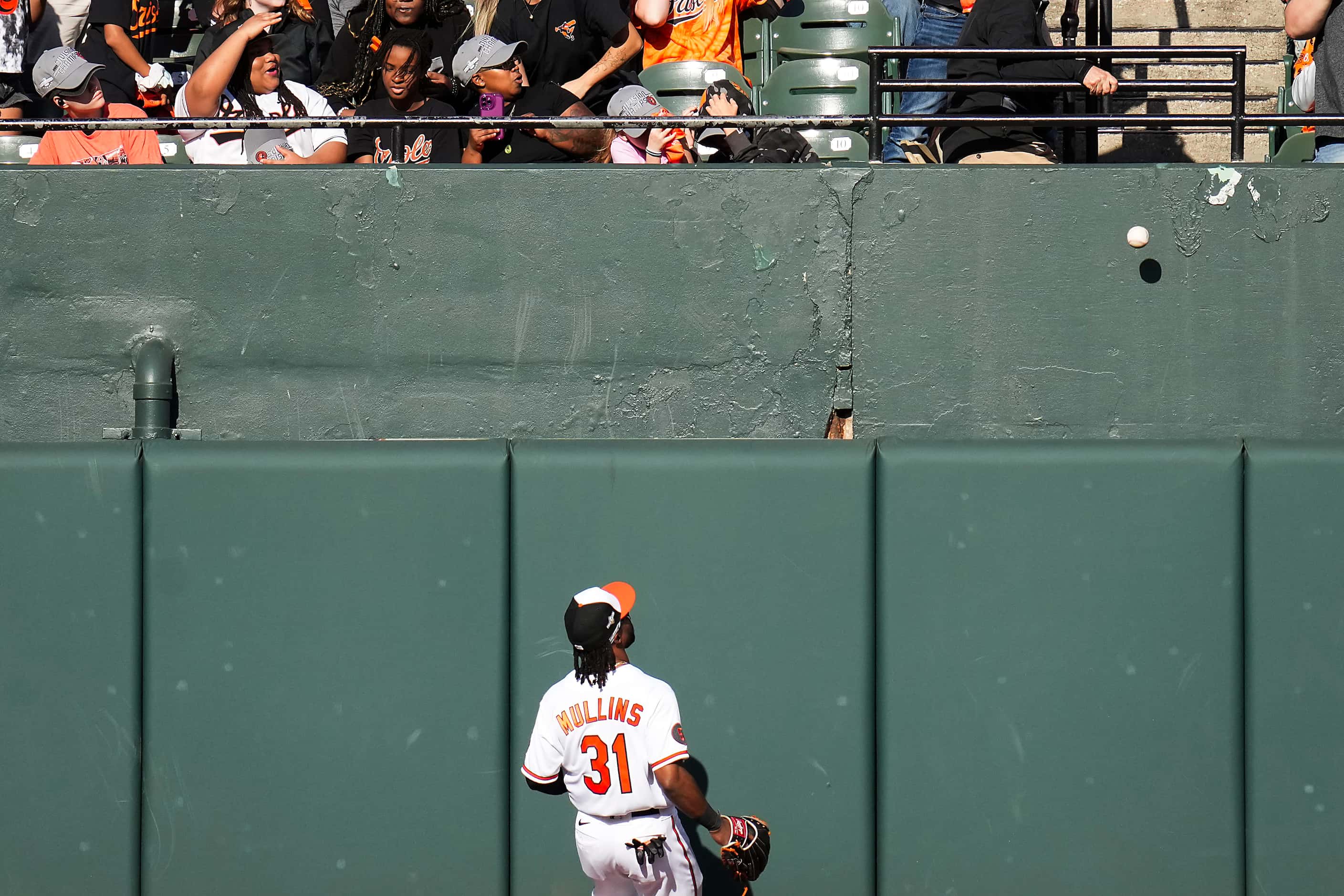 Baltimore Orioles center fielder Cedric Mullins watches a home run off the bat of Texas...