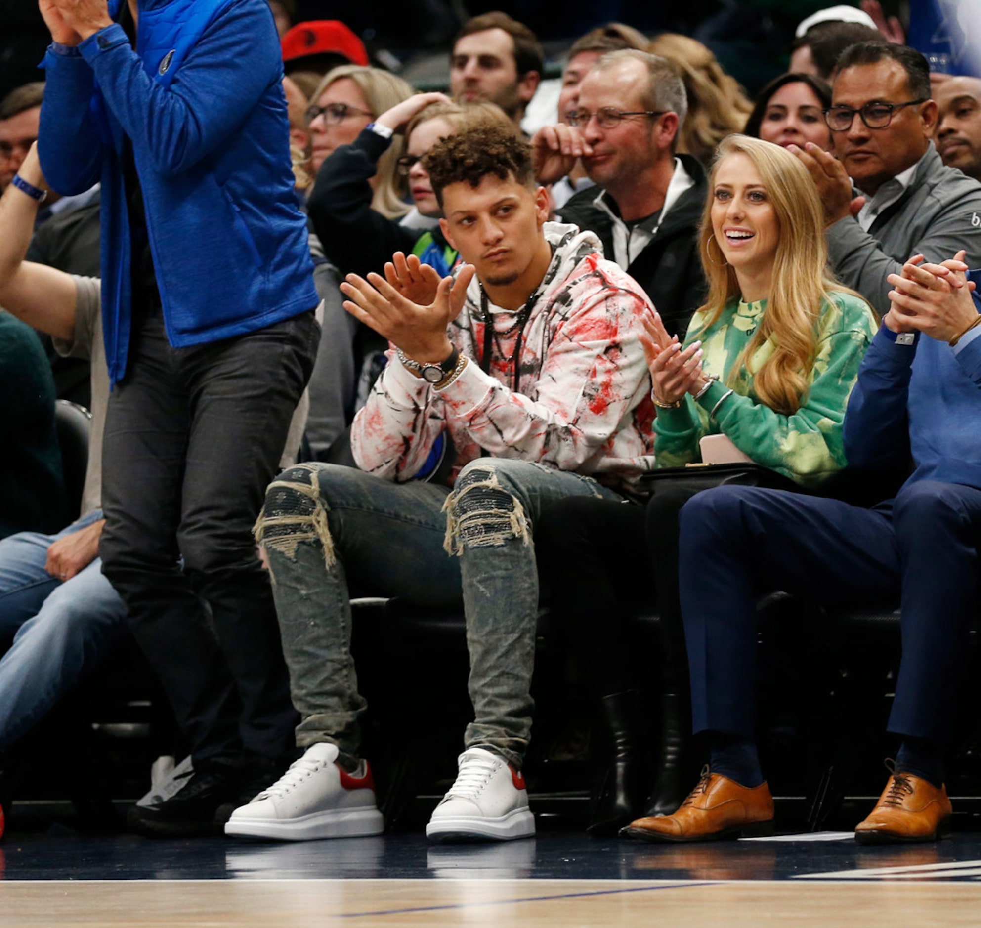 Kansas City Chiefs quarterback Patrick Mahomes sits court side during the first quarter of...