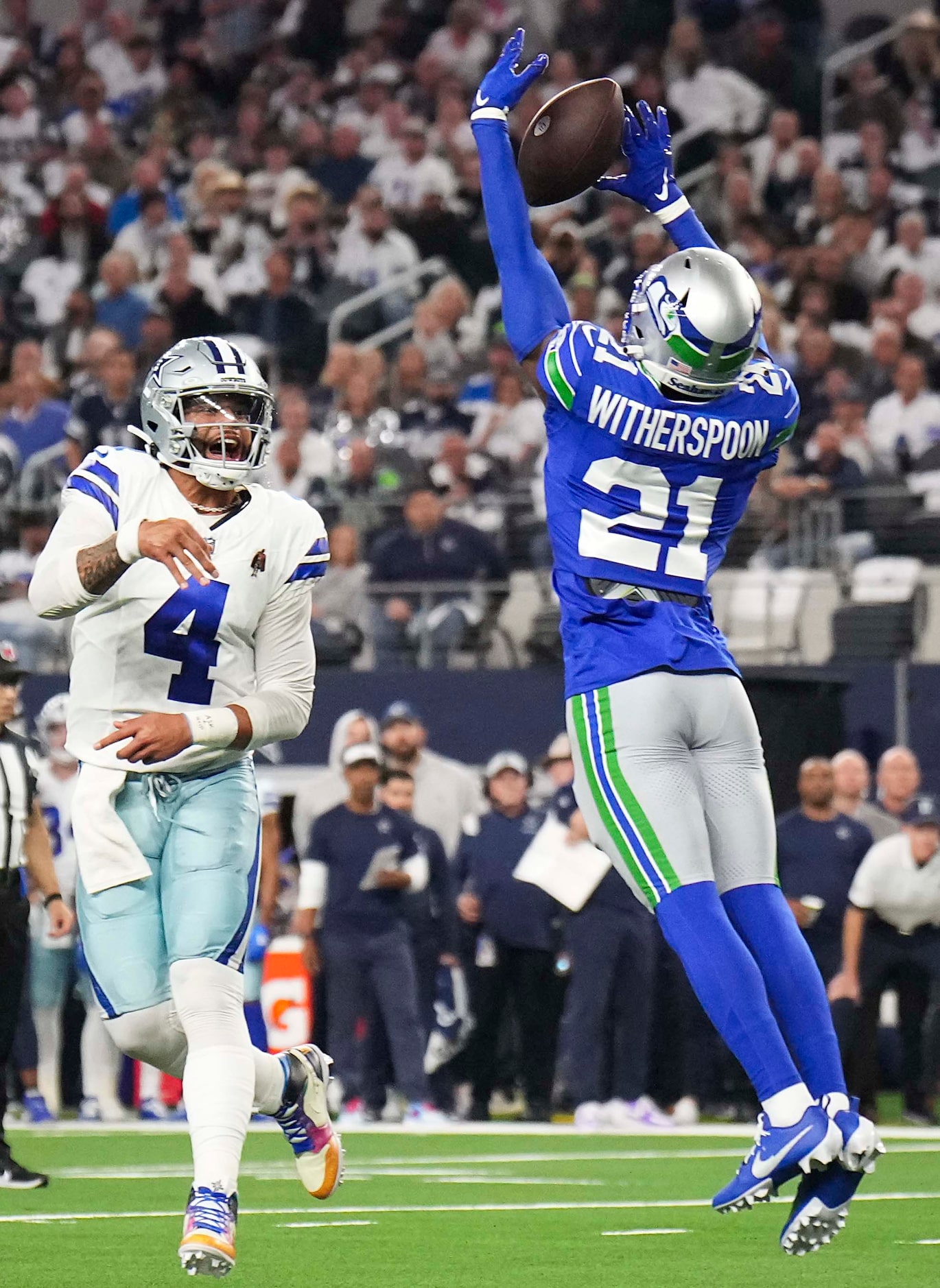 Seattle Seahawks cornerback Devon Witherspoon (21) knocks down a pass by Dallas Cowboys...