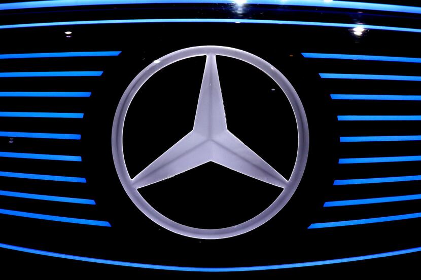 The logo of Mercedes EQ concept car is photographed prior to the annual  news conference at...