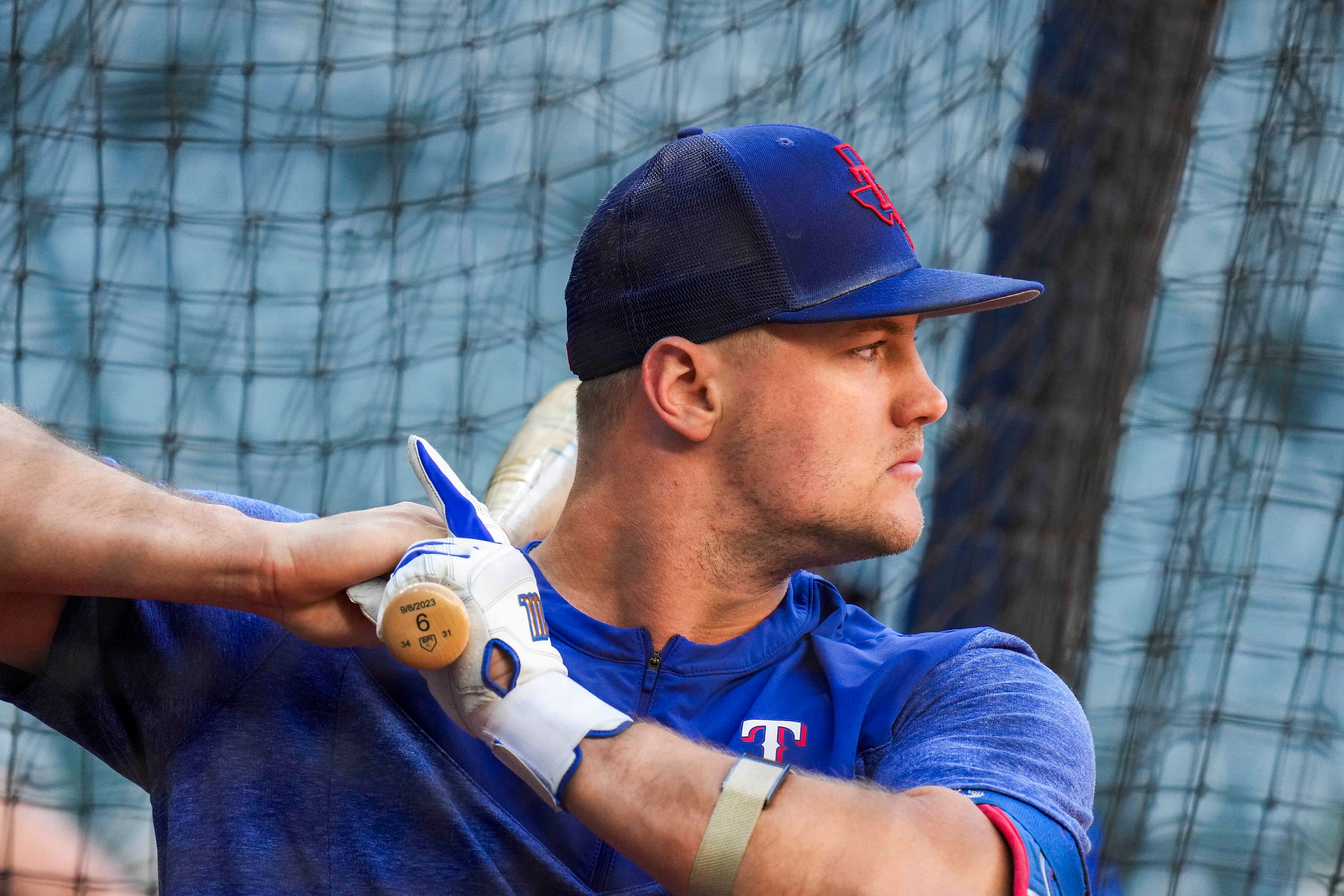 Texas Rangers third baseman Josh Jung takes batting practice during a workout in preparation...