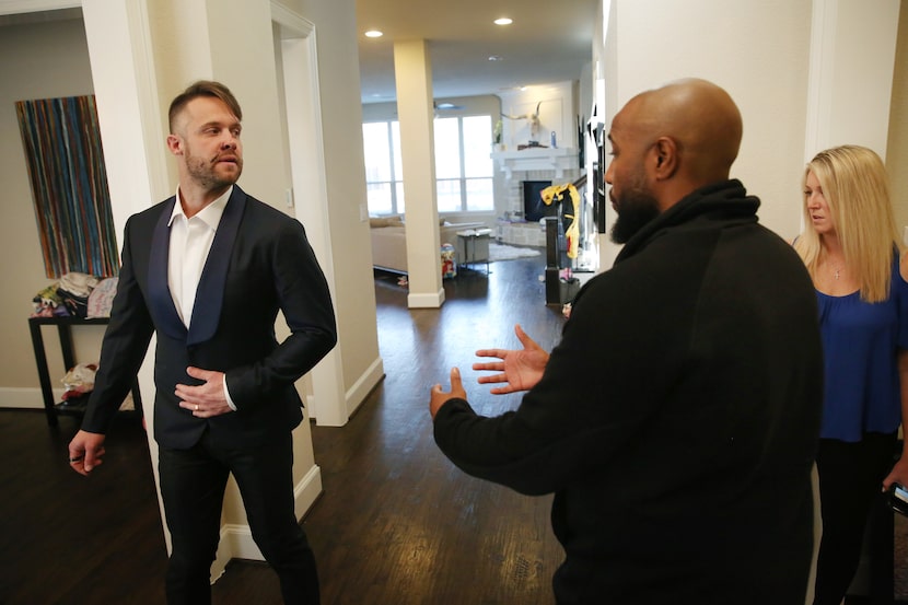 With scars on his face from a recent dog attack, David Vobora (left) preps for speaking...