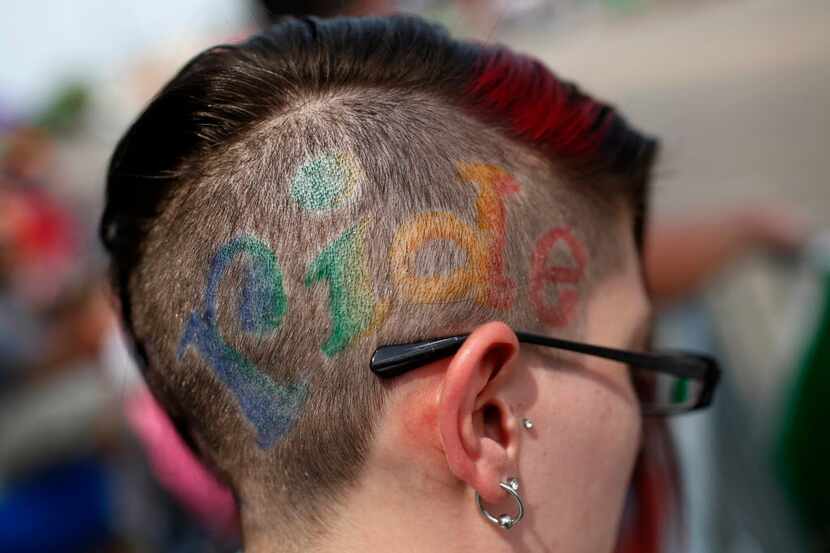 Cole Masters wrote "Pride" on her head during the 30th Annual Dallas Gay Pride Parade,...