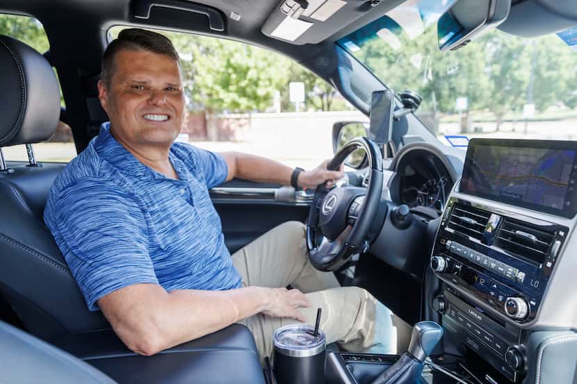Uber driver Michael Watson pictured in his Lexus GX 460 SUV before starting work for the MLB...