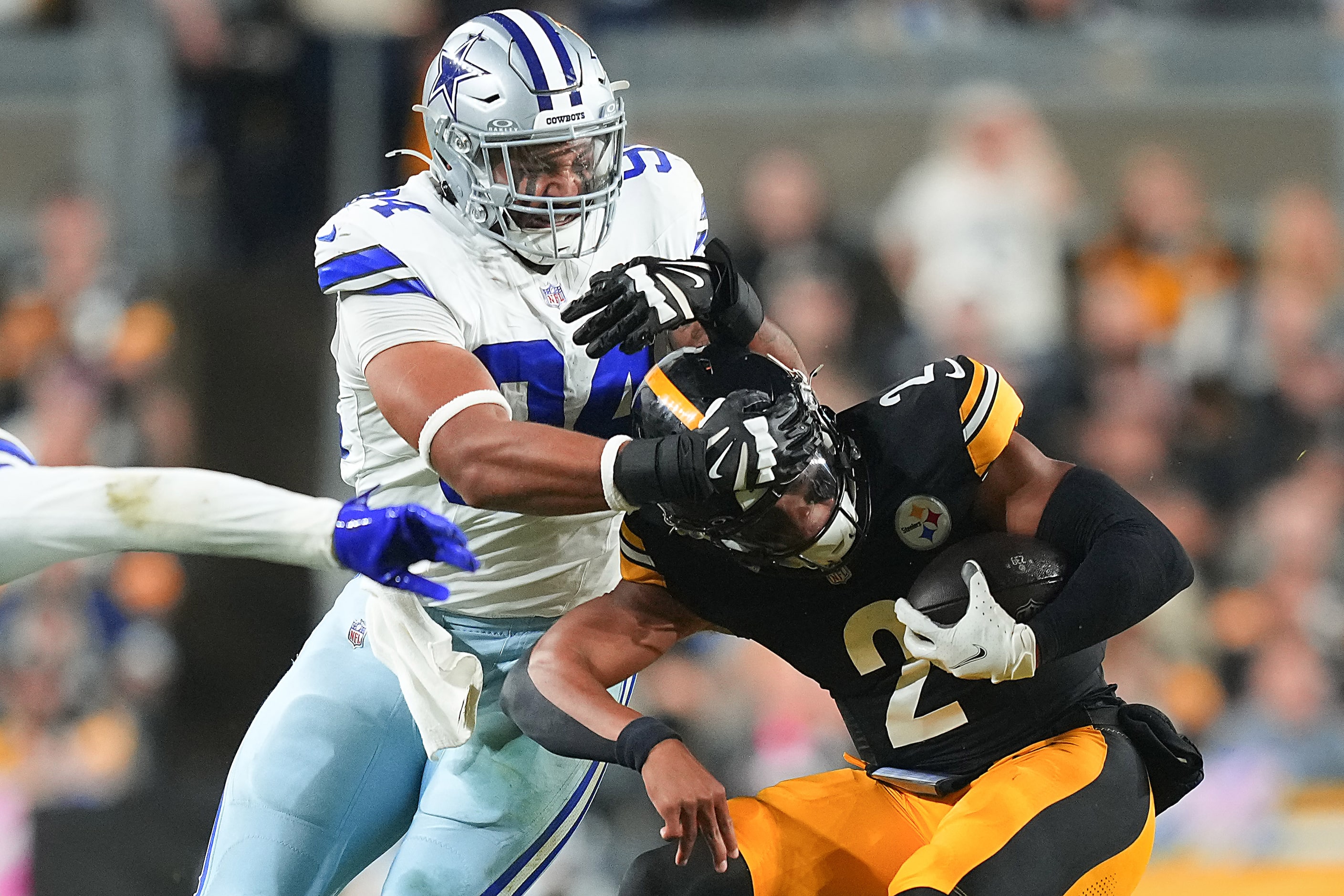 Pittsburgh Steelers quarterback Justin Fields (2) is brought down by Dallas Cowboys...