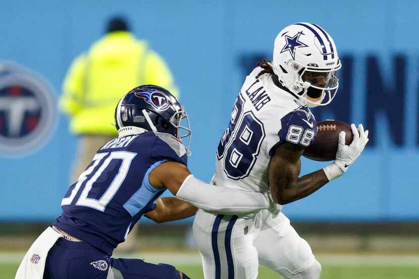 Dallas Cowboys wide receiver CeeDee Lamb (88) makes a catch ahead of Tennessee Titans...