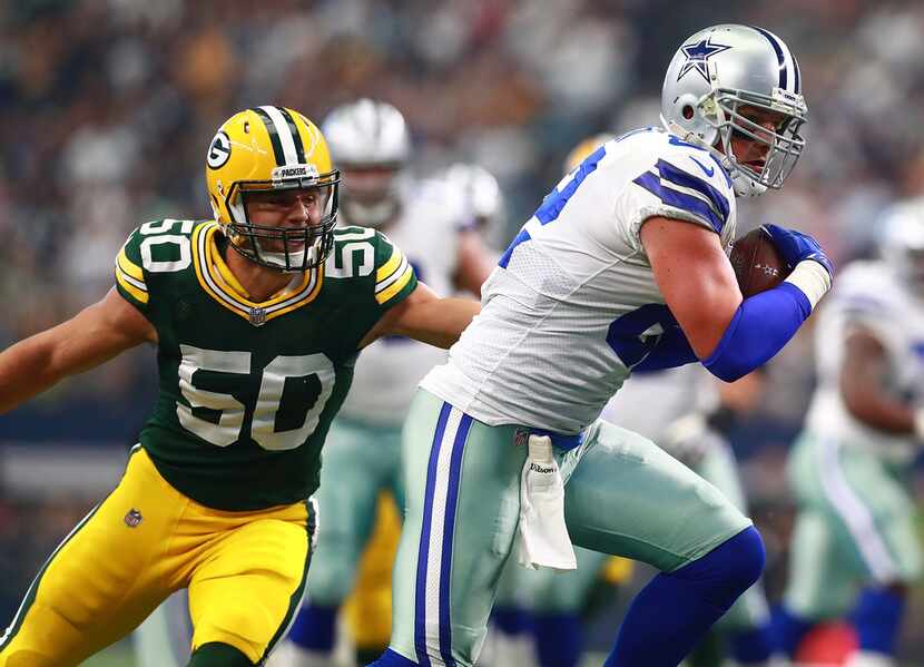 ARLINGTON, TX - OCTOBER 08:  Blake Martinez #50 of the Green Bay Packers tries to stop Jason...