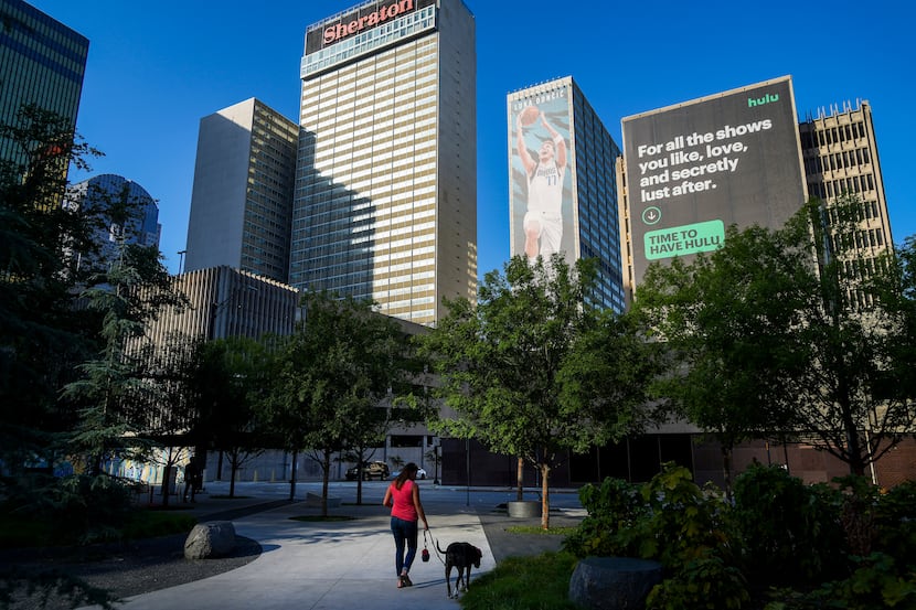 Sabrina Abney walks her dog Harry at Pacific Plaza downtown on Tuesday, Aug. 24, 2021, in...