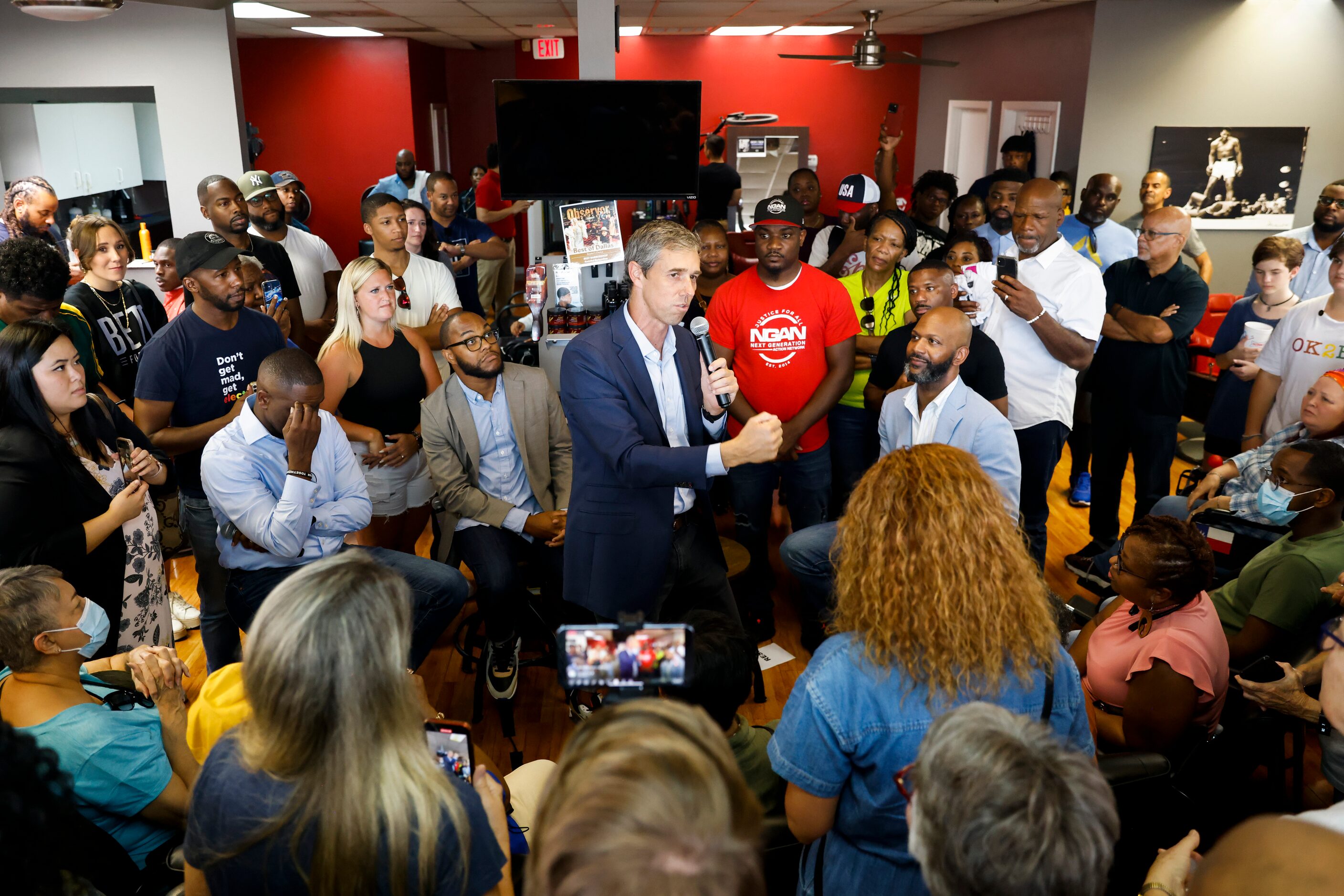 Supporters surrounds and cheers for Texas Governor candidate Beto O'Rourke as he speaks at...