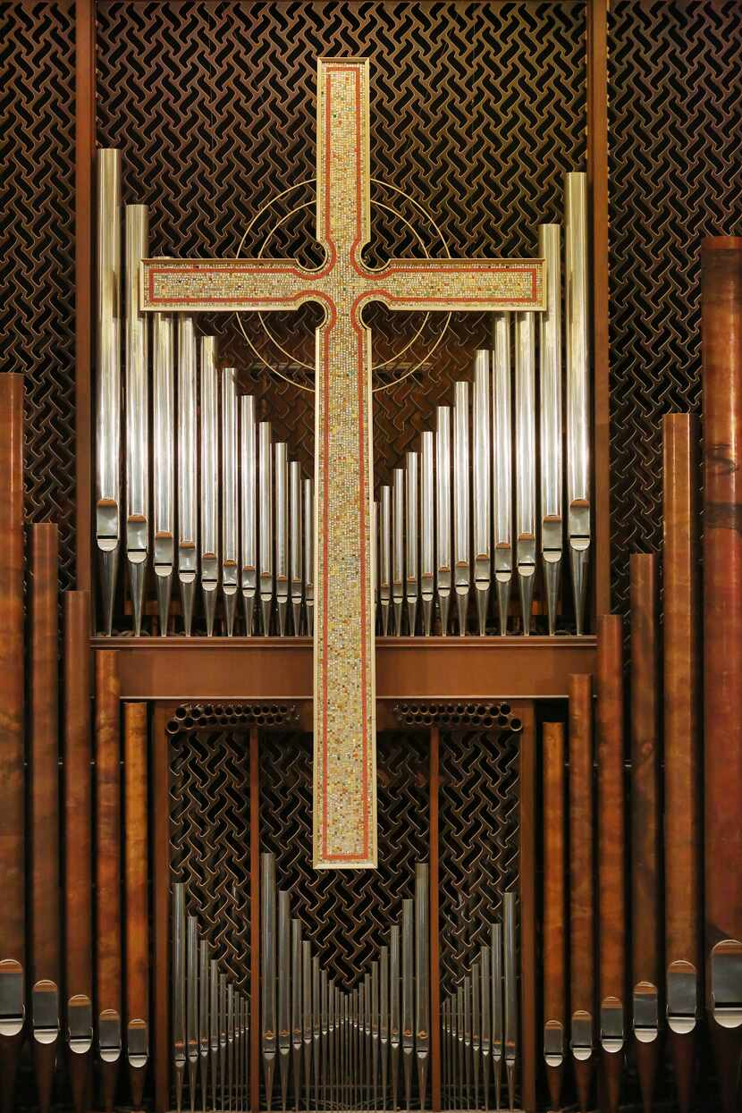 The organ and a mosaic cross inside the sanctuary.