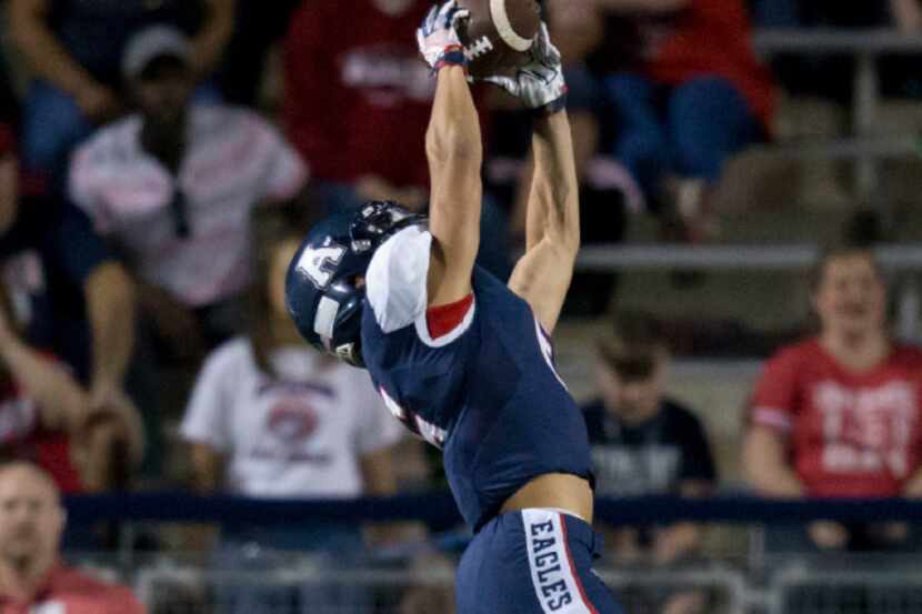 Allen Eagles Carson Schleker (6) catches a pass during the high school football game between...