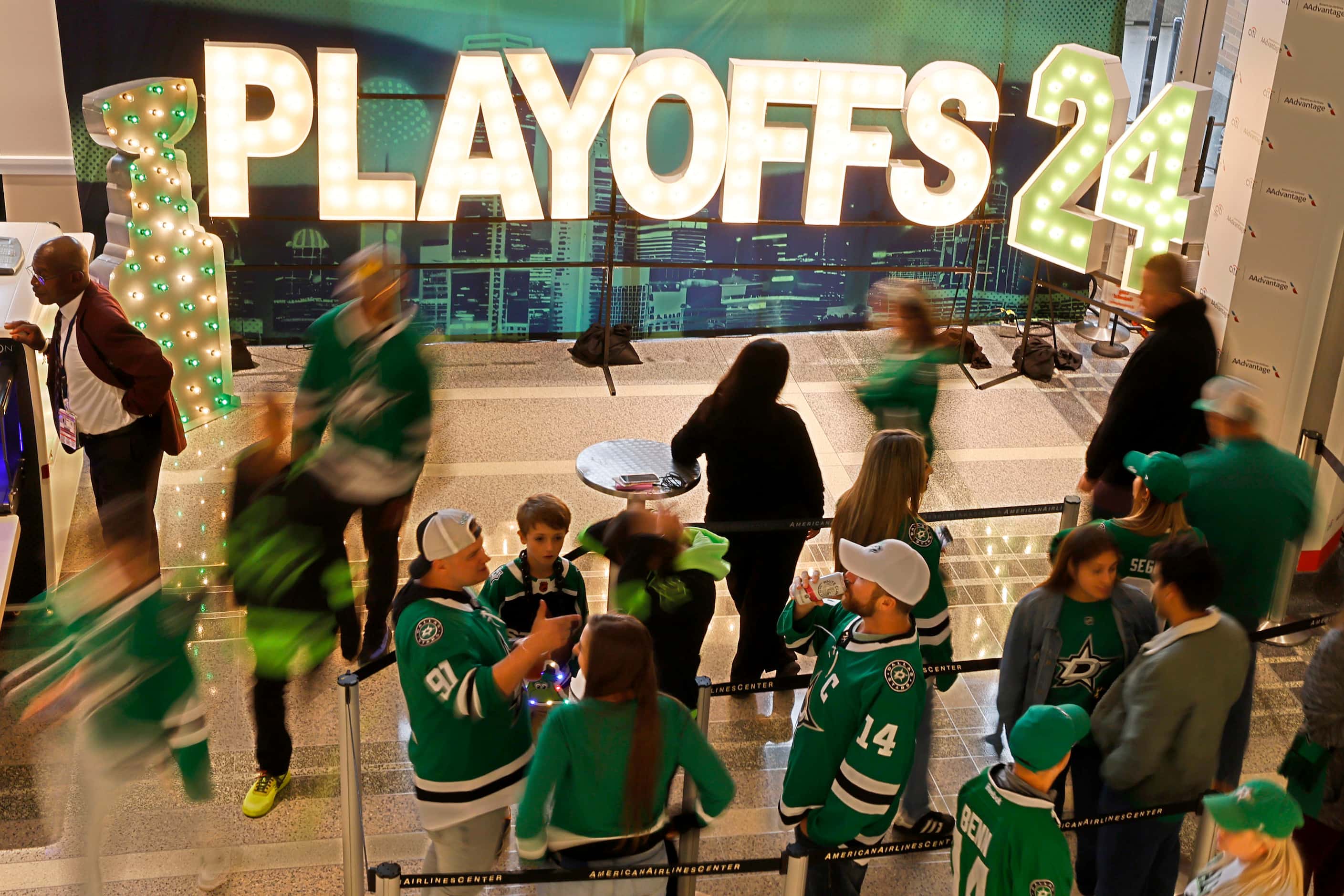 Fans line up for taking photos in front of “ Playoffs 24 ”sign before Game 2 of an NHL...