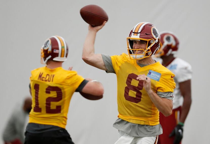 Washington Redskins quarterback Kirk Cousins (8) throws the ball during practice at the...