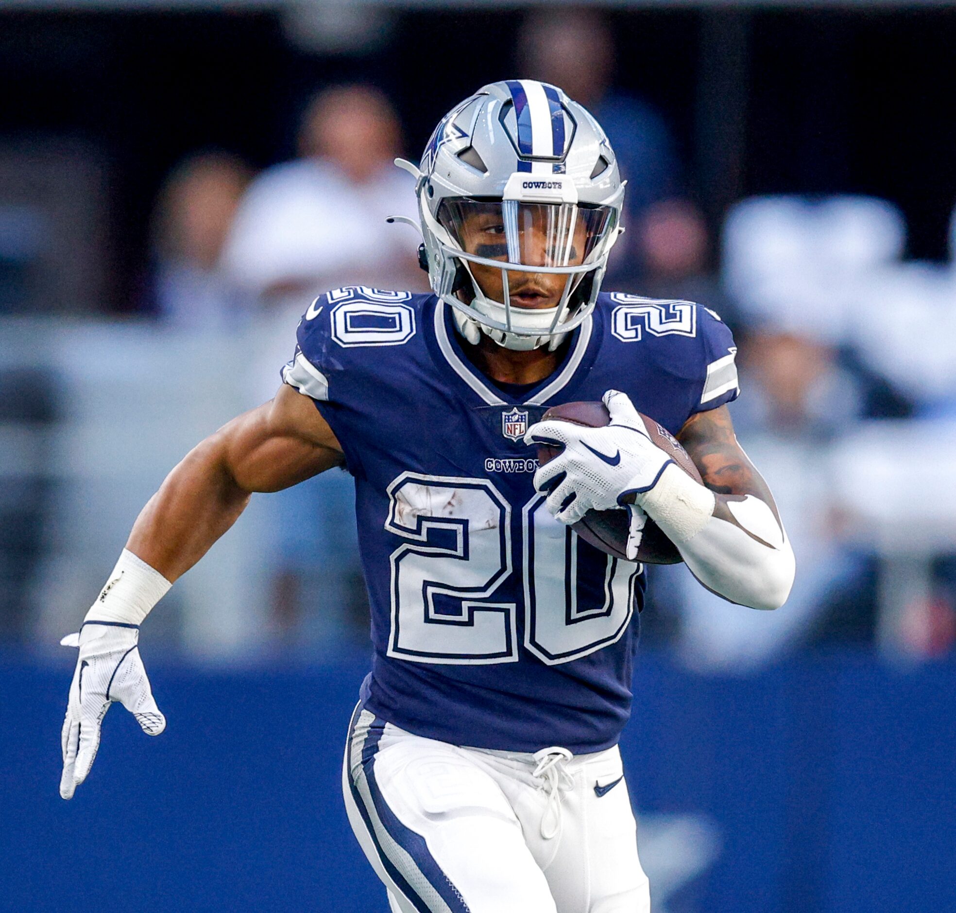 Dallas Cowboys running back Tony Pollard (20) runs the ball during the first half of an NFL...