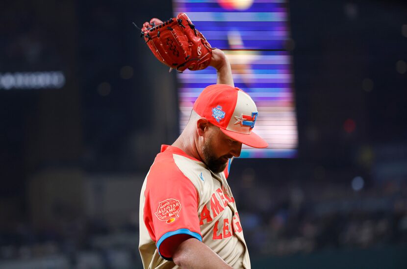 American League pitcher Kirby Yates, of the Texas Rangers, waves to the applause after  he...