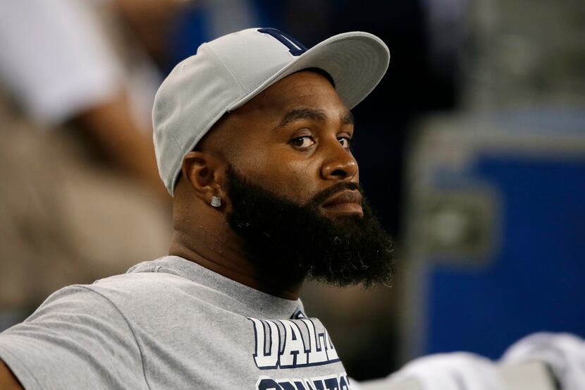 FILE - In this Sept. 8, 2013, file photo, Dallas Cowboys' Anthony Spencer sits on the bench...
