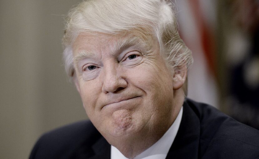 U.S. President Donald Trump smiles during a parent-teacher conference listening session...