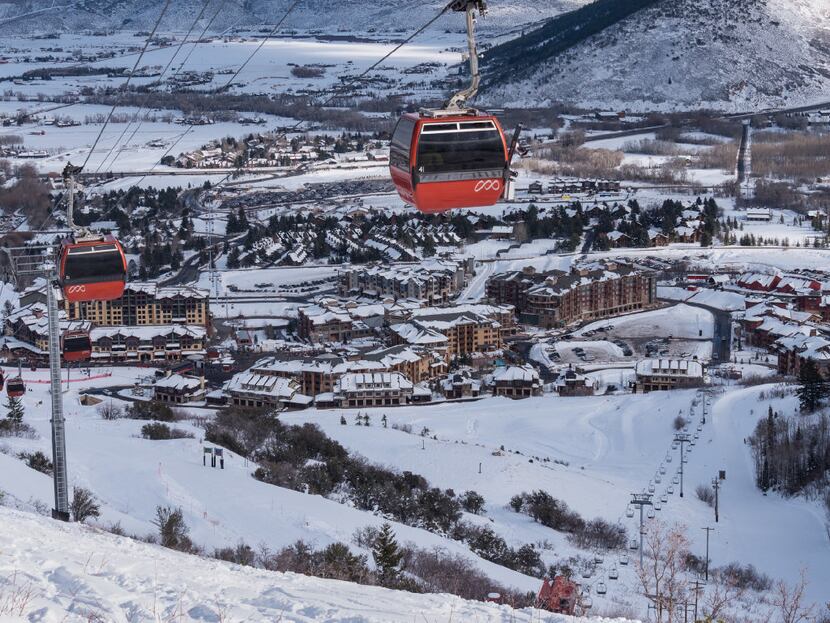 The Red Pine Gondola rises above Park City's Canyons Village base.  Guests at the Waldorf...