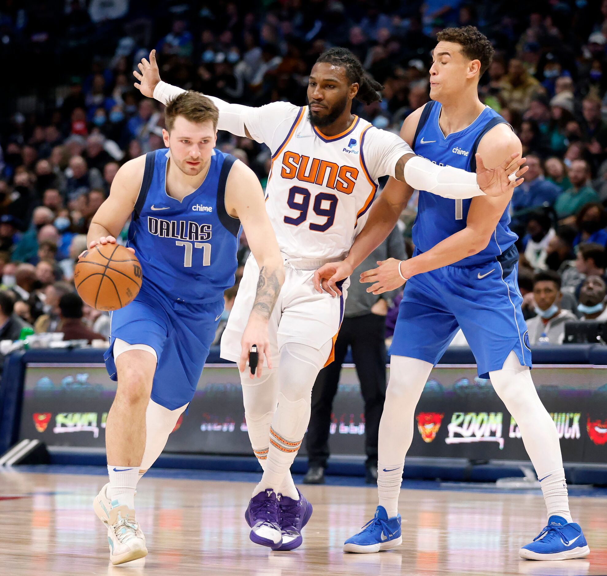 Dallas Mavericks guard Luka Doncic (77) shoved Phoenix Suns forward Jae Crowder (99) out of...