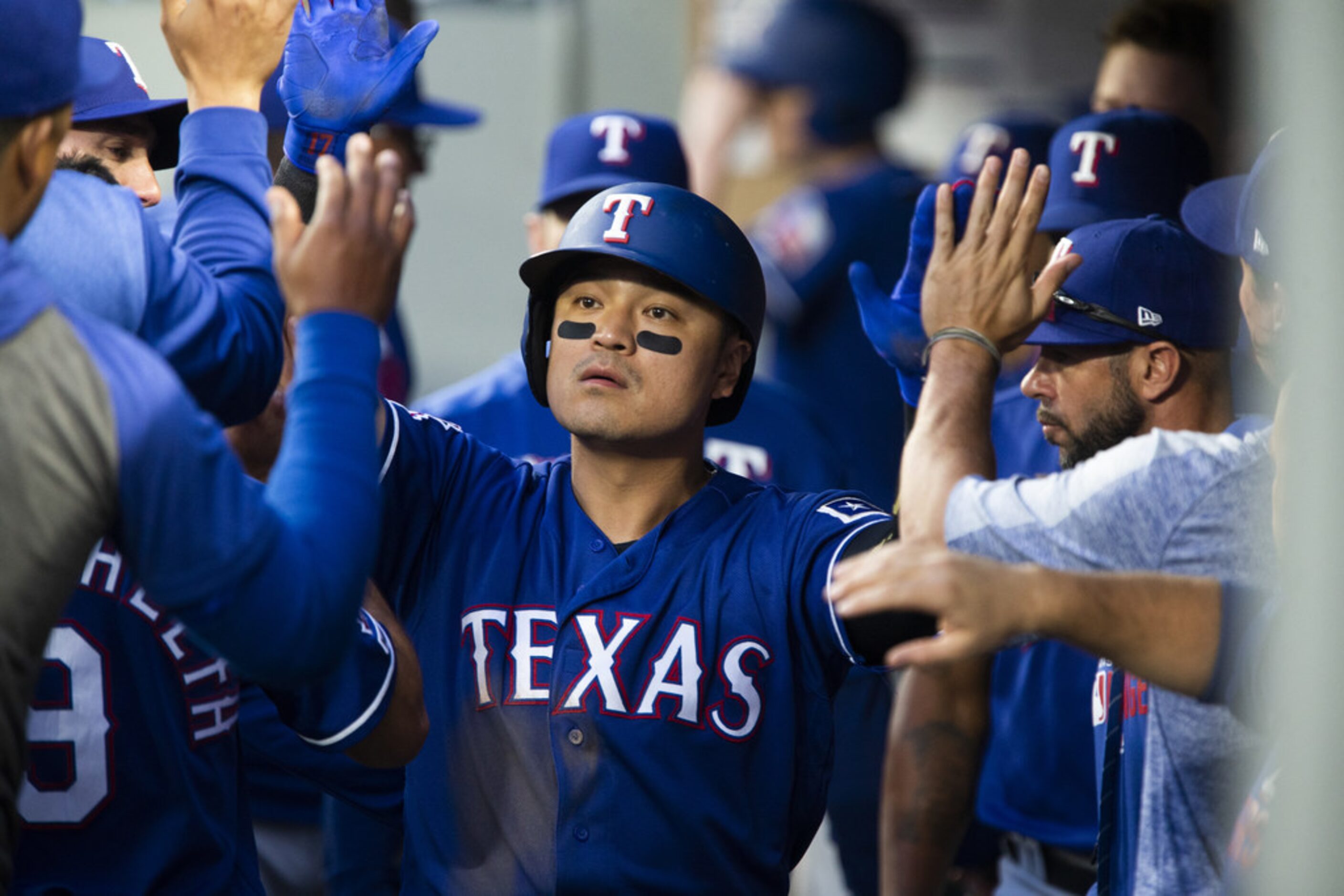 SEATTLE, WA - MAY 28:  Shin-Soo Choo #17 of the Texas Rangers is greeted in the dugout after...