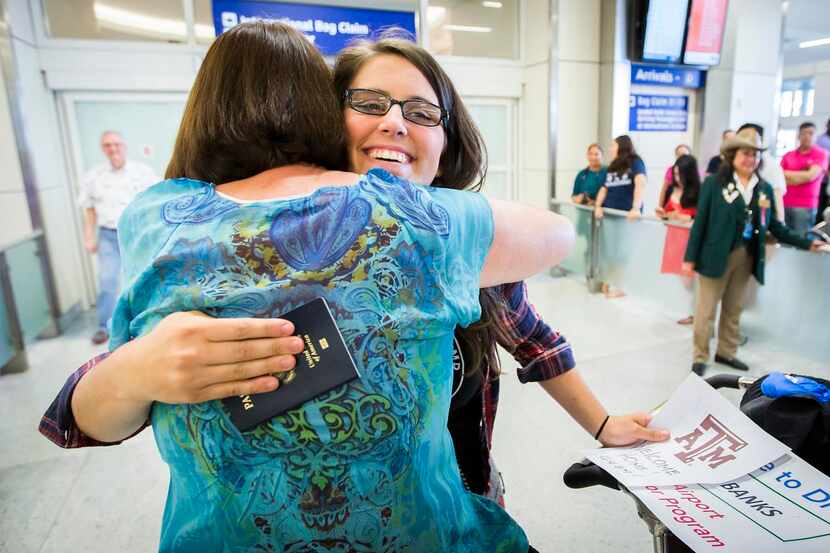 
Danielle Banks gets a hug from her mother Sharon Banks after arriving at DFW Airport on...